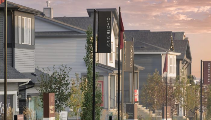 Front Drive showhome parade in Glacier Ridge with signs and banners.